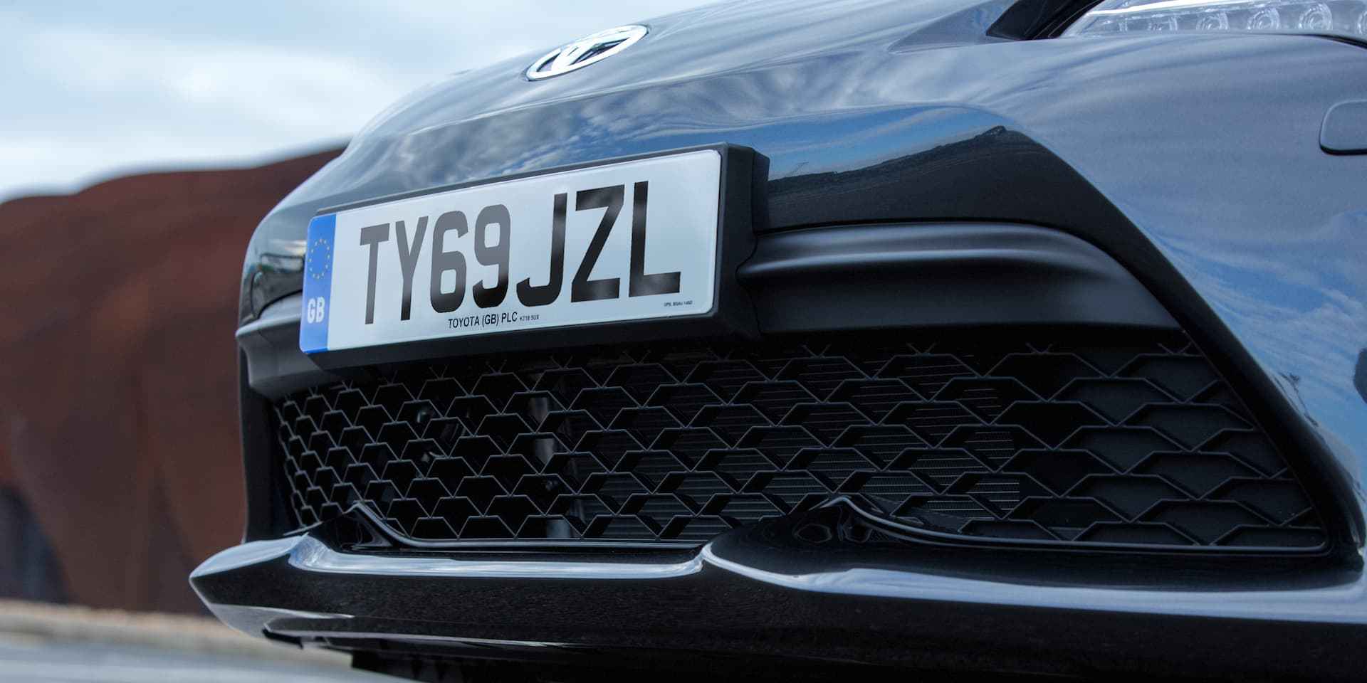 A black car with a personalized number plate